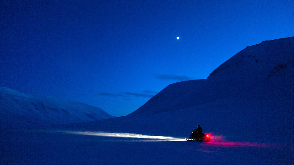 Snowscooter driving in the blue hour season ©-Marcel Schütz-2020